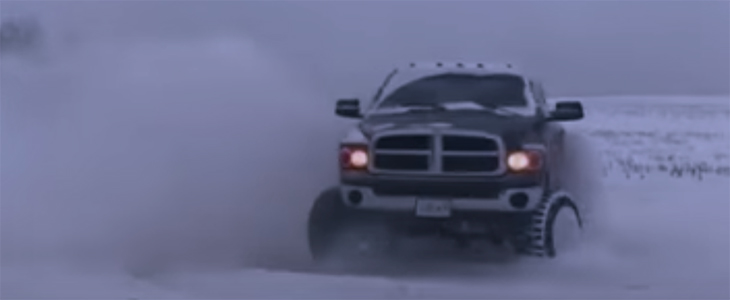 a mini truck is drifting in the winter snow