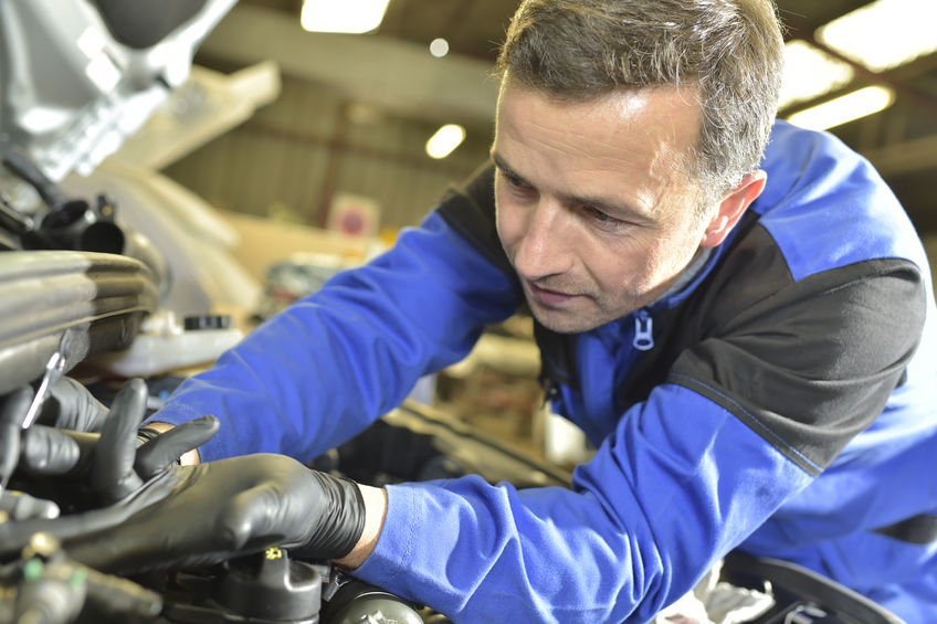 Technician working in auto repair shop