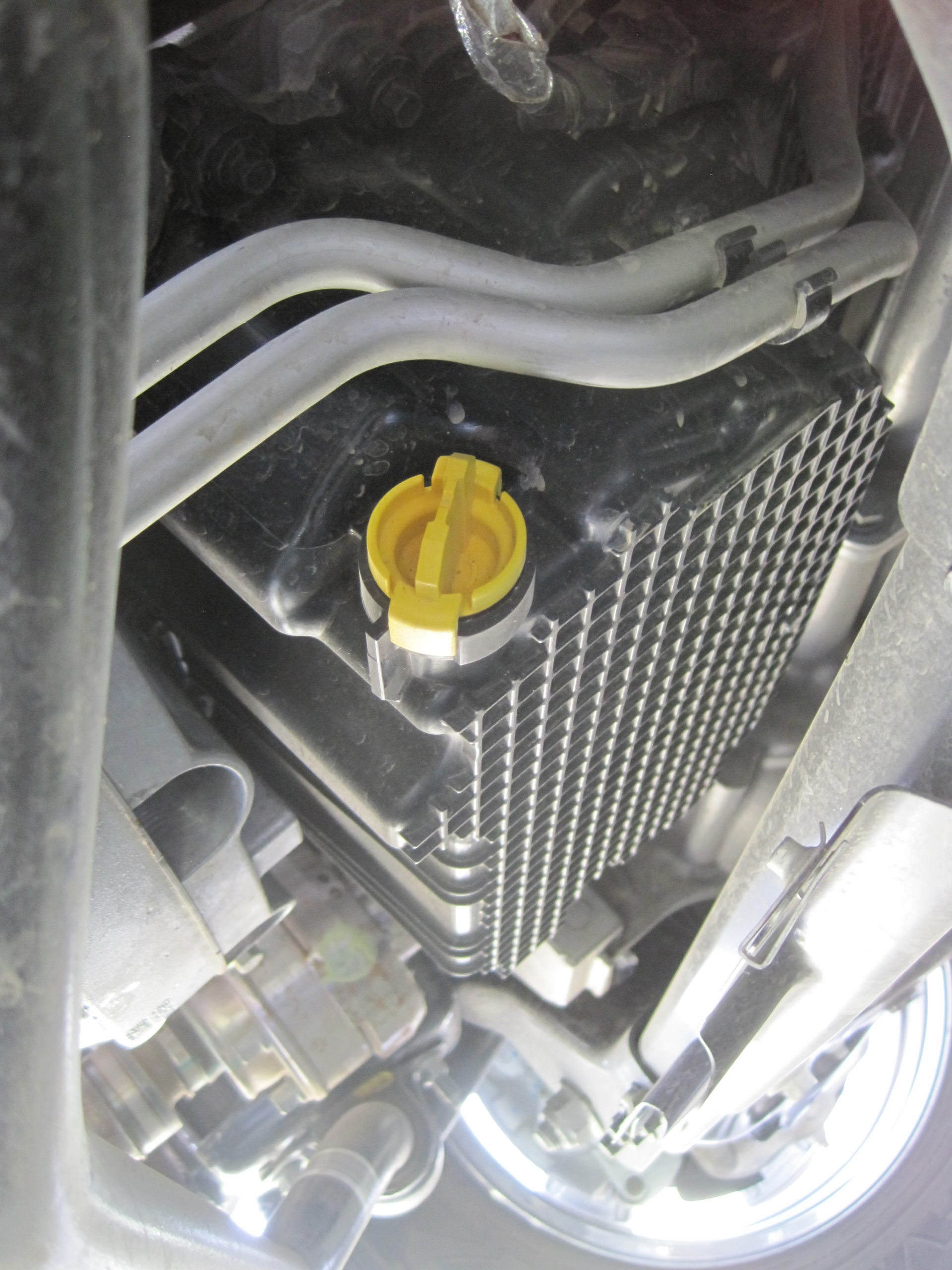 image shows plastic drain plug inserted into fords plastic oil pan for 2.7L ecoboost