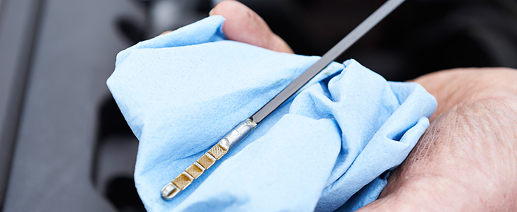 image depicts oil dipstick for checking oil level